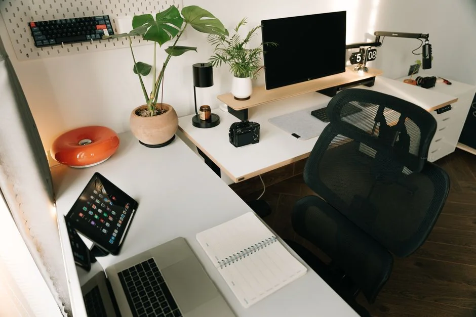 A modern computer screen displaying web design work, showcasing creative visuals in a workspace.